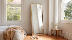 bedroom floor mirror leaning wall oversized gold frame 2026